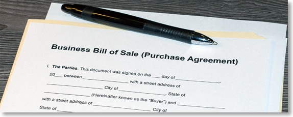 Physical copy of a mergers and acquisitions contract that's titled "Business Bill of Sale Purchase Agreement."
