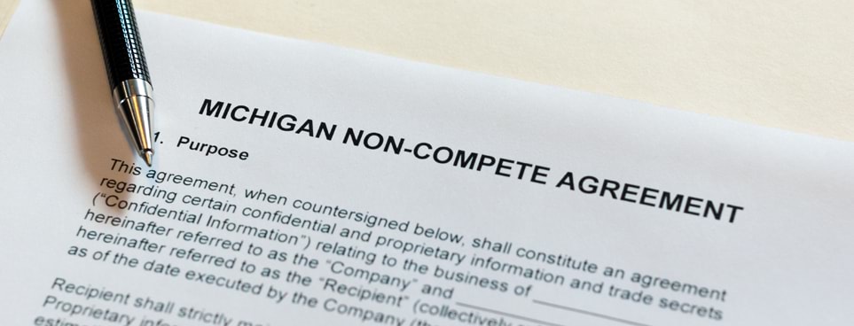 Michigan non-compete agreement form, outlining the main points of the agreement with a zebra retractable pen sitting on top of the page